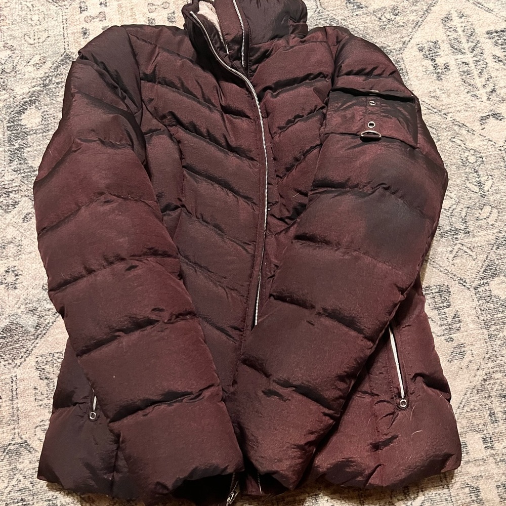 Burgundy iridescent Eddie Bauer puffer jacket women’s size medium.